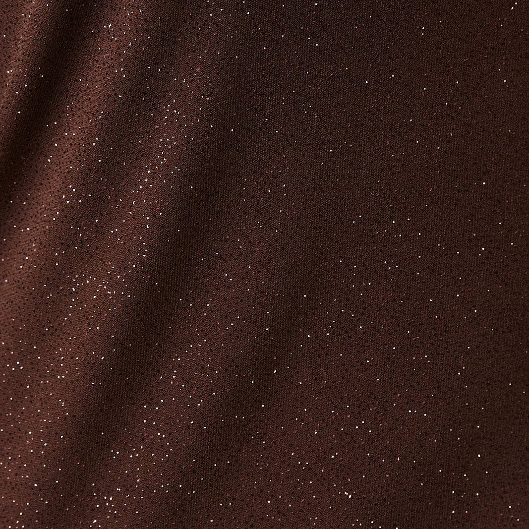 Close-up of brown fabric with a subtle texture