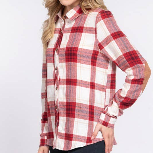 Woman wearing a red and white plaid shirt on a white background
