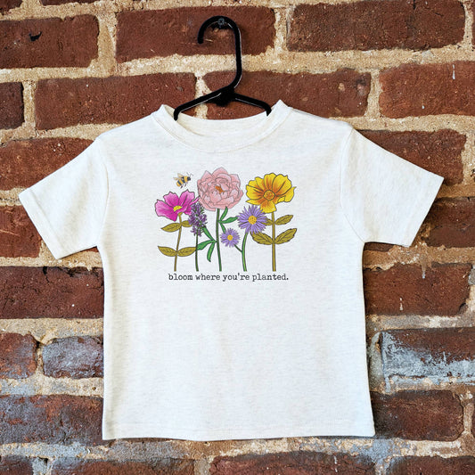 cotton tee with flowers hanging on hanger