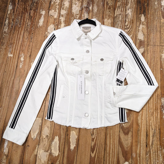 Front view of women's white striped denim trucker jacket