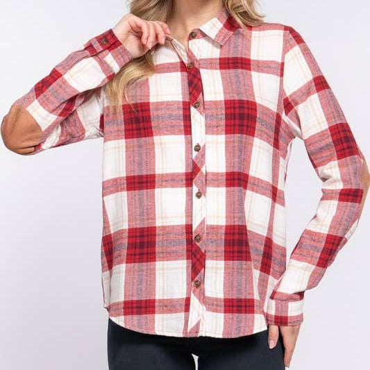 Woman wearing a red and white plaid shirt on a white background