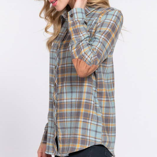 Woman wearing a plaid shirt on a white background